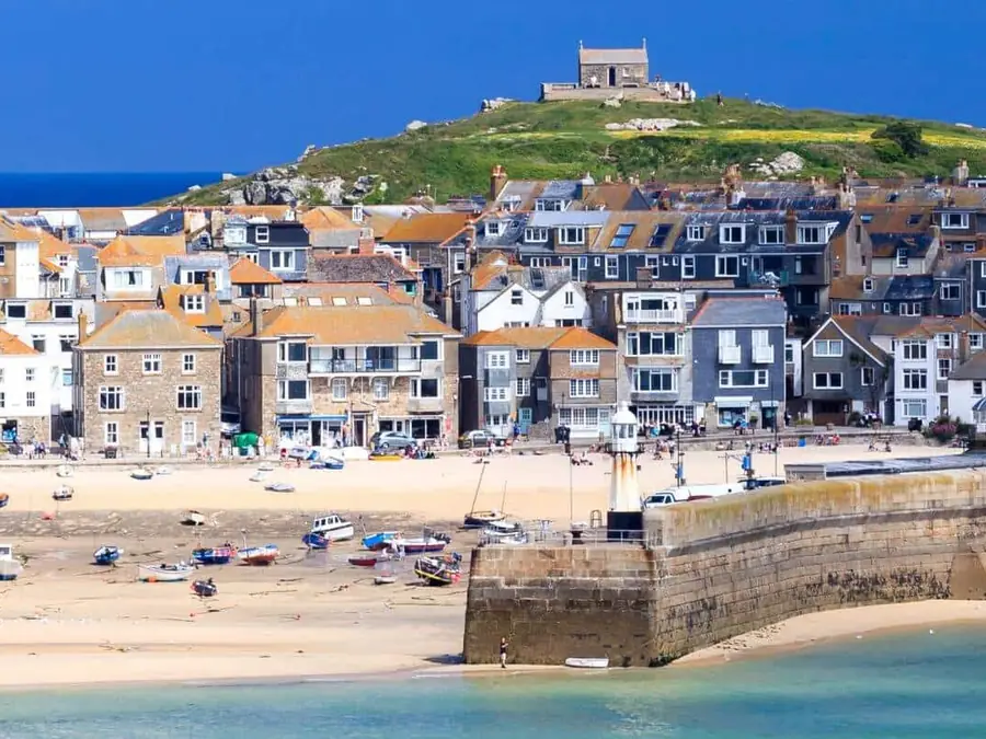 St Ives harbour and town rooftops above the beach in west Cornwall